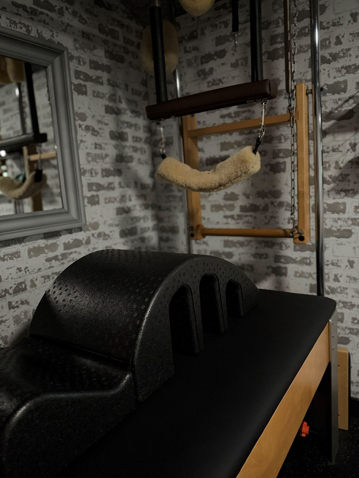 The tower and trapeze setup against the brick wall